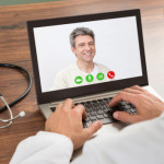 Doctor Talking To Patient Through Video Chat